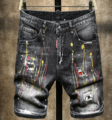 Yellow-painted distressed denim shorts