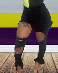 Vaqueros ajustados con dobladillo dividido y desgastado con dobladillo sin rematar