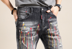 Yellow-painted distressed denim shorts