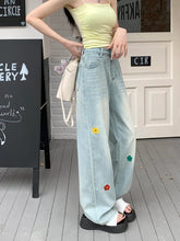 Vaqueros retro de cintura alta y pierna ancha con flores bordadas