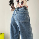 Drapierte Jeans mit weitem Bein und elastischer Taille