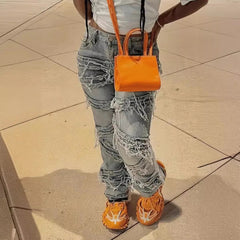 Layered ripped washed straight-leg fringe jeans