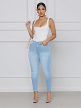 Zerrissene Skinny Jeans mit hoher Taille