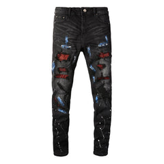 Vaqueros negros con estampado de salpicaduras de pintura