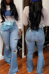 Vintage High Rise Ripped Ripped Flared Jeans