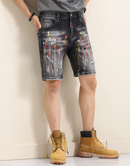 Yellow-painted distressed denim shorts