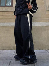 Pantalones paracaídas holgados con paneles retro en contraste de color