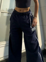 Pantalones deportivos vintage con cordón bordado y números