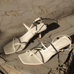 Sandalias de piel sintética con tacón medio y tiras Ricmod