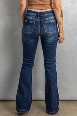 Vaqueros bootcut desgastados con bragueta de botones