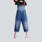 Jeans-Jumpsuit mit farbigen Hosenträgern