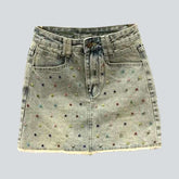 Jeansrock mit bunten Verzierungen