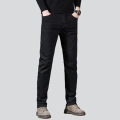 Vaqueros negros ajustados y elásticos para hombre