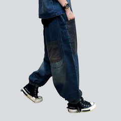 Pantalones vaqueros harén con parches oscuros