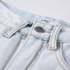 Vaqueros holgados de mujer desgastados y blanqueados