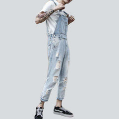 Light wash distressed denim jumpsuit