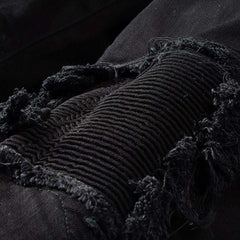 Vaqueros biker ajustados con parches negros