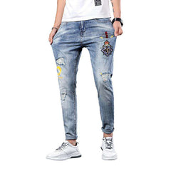 Vaqueros de hombre con bordado azul claro
