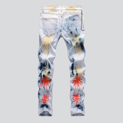 Vaqueros de hombre pintados con palmeras rojas