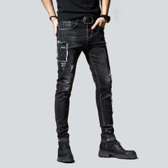 Bestickte, dehnbare schwarze Herrenjeans