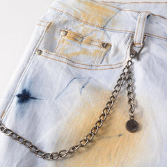 Vaqueros de hombre pintados con palmeras rojas