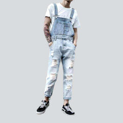 Light wash distressed denim jumpsuit