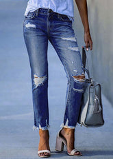 Pantalones vaqueros ajustados de corte moderno en azul oscuro con borlas