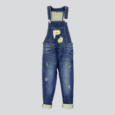 Schmale Jeans-Latzhose mit Rissen an der Brust