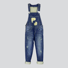 Schmale Jeans-Latzhose mit Rissen an der Brust