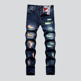Zerrissene Jeans mit Neon-Patches