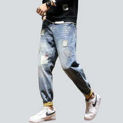 Vaqueros para hombre con dobladillo amarillo grabado