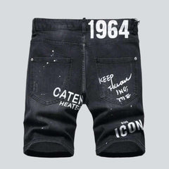 Black inscribed ripped denim shorts