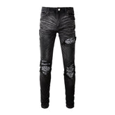 Schwarze zerrissene Vintage-Bikerjeans
