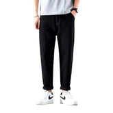 Vaqueros lavados a la piedra de cintura media para hombre