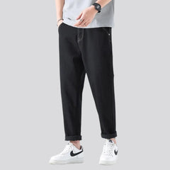 Vaqueros lavados a la piedra de cintura media para hombre