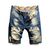 Pantalones cortos vaqueros desgastados de color azul retro