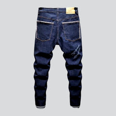 Trendy style dark distressed jeans