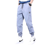 Pantalones deportivos de mezclilla de color liso para hombre