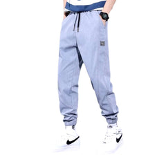 Pantalones deportivos de mezclilla de color liso para hombre