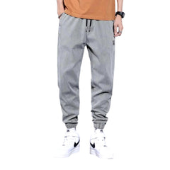 Pantalones deportivos de mezclilla de color liso para hombre