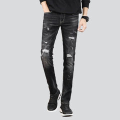 Slightly ripped black men jeans
