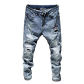 Hellblaue zerrissene Herrenjeans