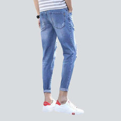 Vaqueros rotos de lavado claro para hombre