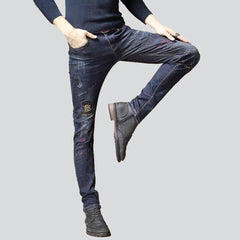 Vaqueros de hombre decorados en azul marino