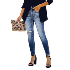 Vaqueros ajustados de mujer con pierna rasgada