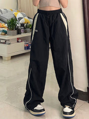 Schwarze Baggy Oldschool Jogginghose mit kontrastfarbenem Paspeldetail