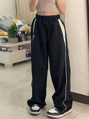 Schwarze Baggy Oldschool Jogginghose mit kontrastfarbenem Paspeldetail