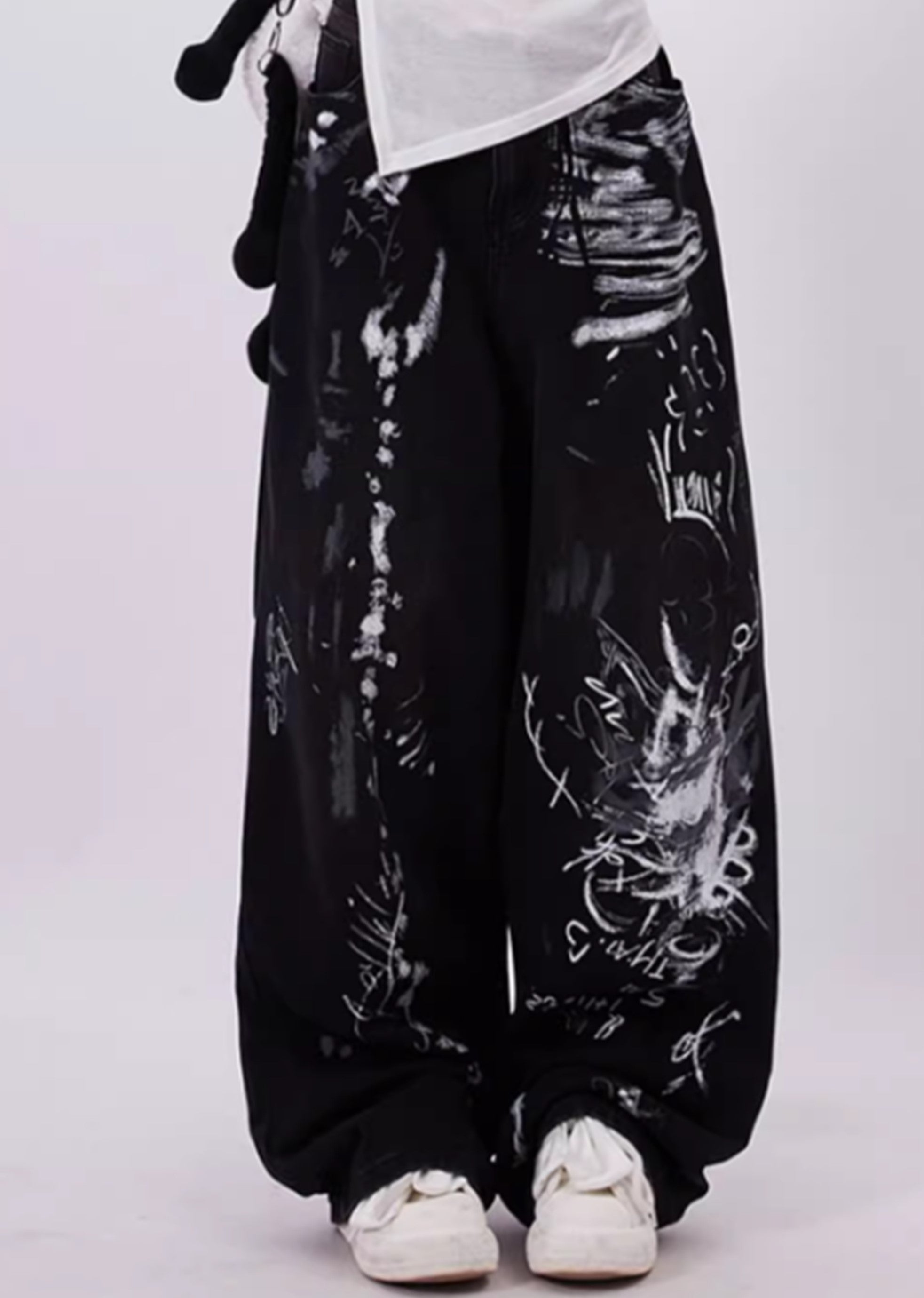 Schwarze Baggy-Jeans mit Grunge-Graffiti-Print