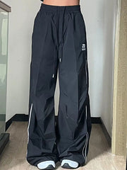 Fallschirmhose mit weitem Bein und Paspelierung im Vintage-Stil
