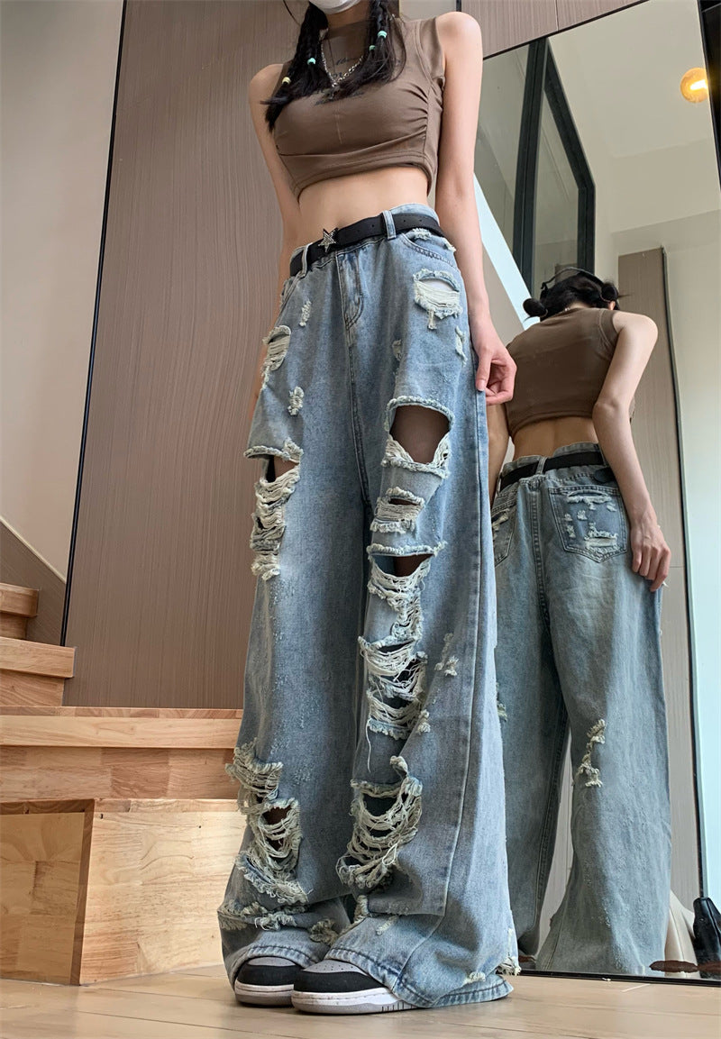 Blaue zerrissene Jeans mit ausgefranstem Punk-Detail und hoher Taille